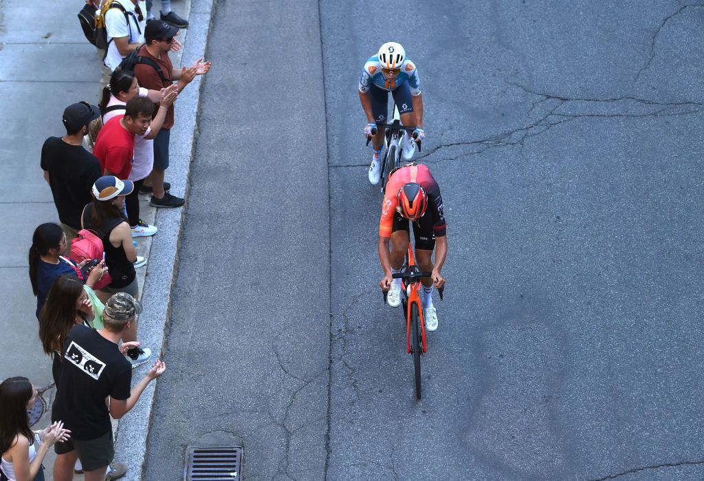 QUEBEC CITY QUEBEC SEPTEMBER 13 LR Frank van den Broek of The Netherlands and Team dsmfirmenich PostNL and Artem Shmidt of The United States and Team INEOS Grenadiers compete in the breakaway while fans cheer during the 13th Grand Prix Cycliste de Quebec 2024 a 2016km one day race from Quebec City to Quebec City UCIWT on September 13 2024 in Quebec City Quebec Photo by Alex BroadwayGetty Images