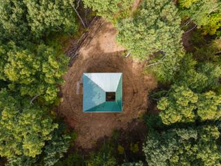 Aerial view of Forest Retreat in clearing in the woods