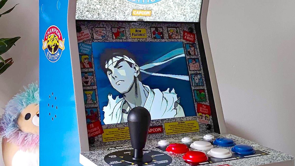 Evercade Alpha closeup with Ryu from Street Fighter on screen