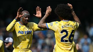 Crystal Palace's French striker #14 Jean-Philippe Mateta (C) and Crystal Palace's US defender #26 Chris Richards (R) prepare ahead of kick-off in the English Premier League football match between Manchester City and Crystal Palace at the Etihad Stadium in Manchester, north west England, on April 12, 2025.