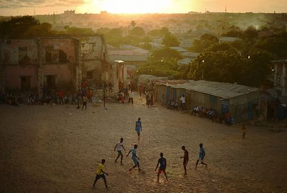 Somalians play soccer in Mogadishu.