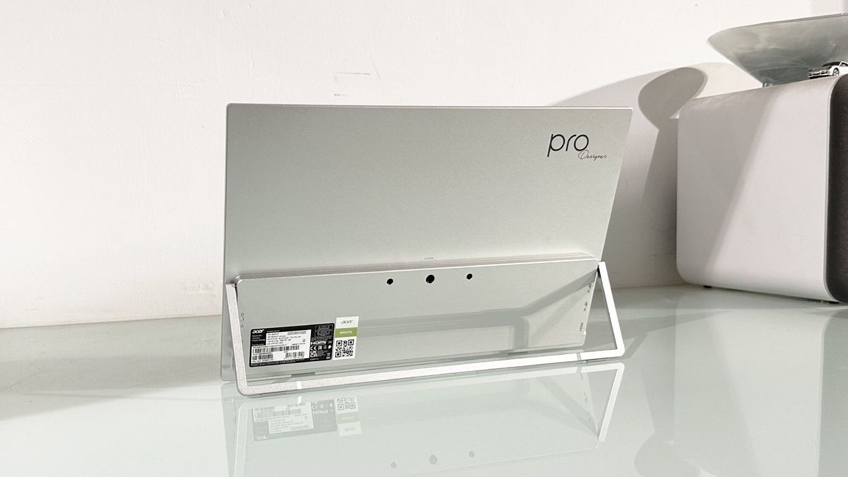 Testing the Acer ProDesigner PE160WUT in a home office next to a MacBook