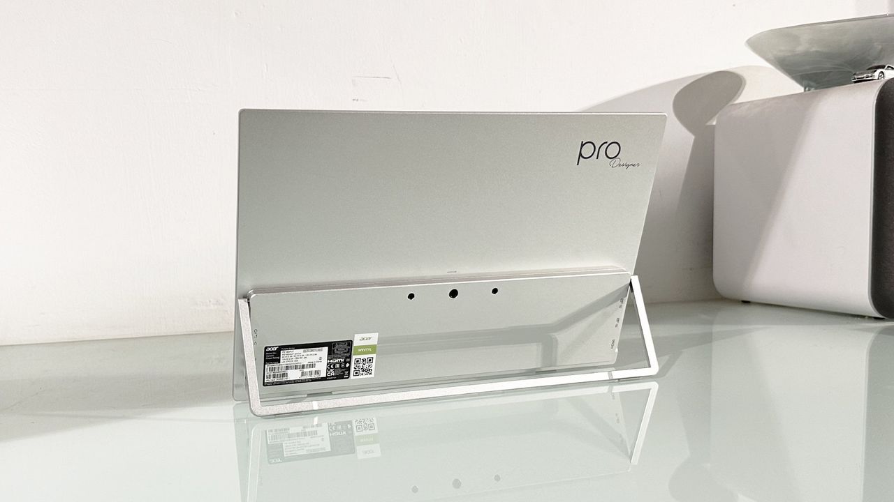 Testing the Acer ProDesigner PE160WUT in a home office next to a MacBook