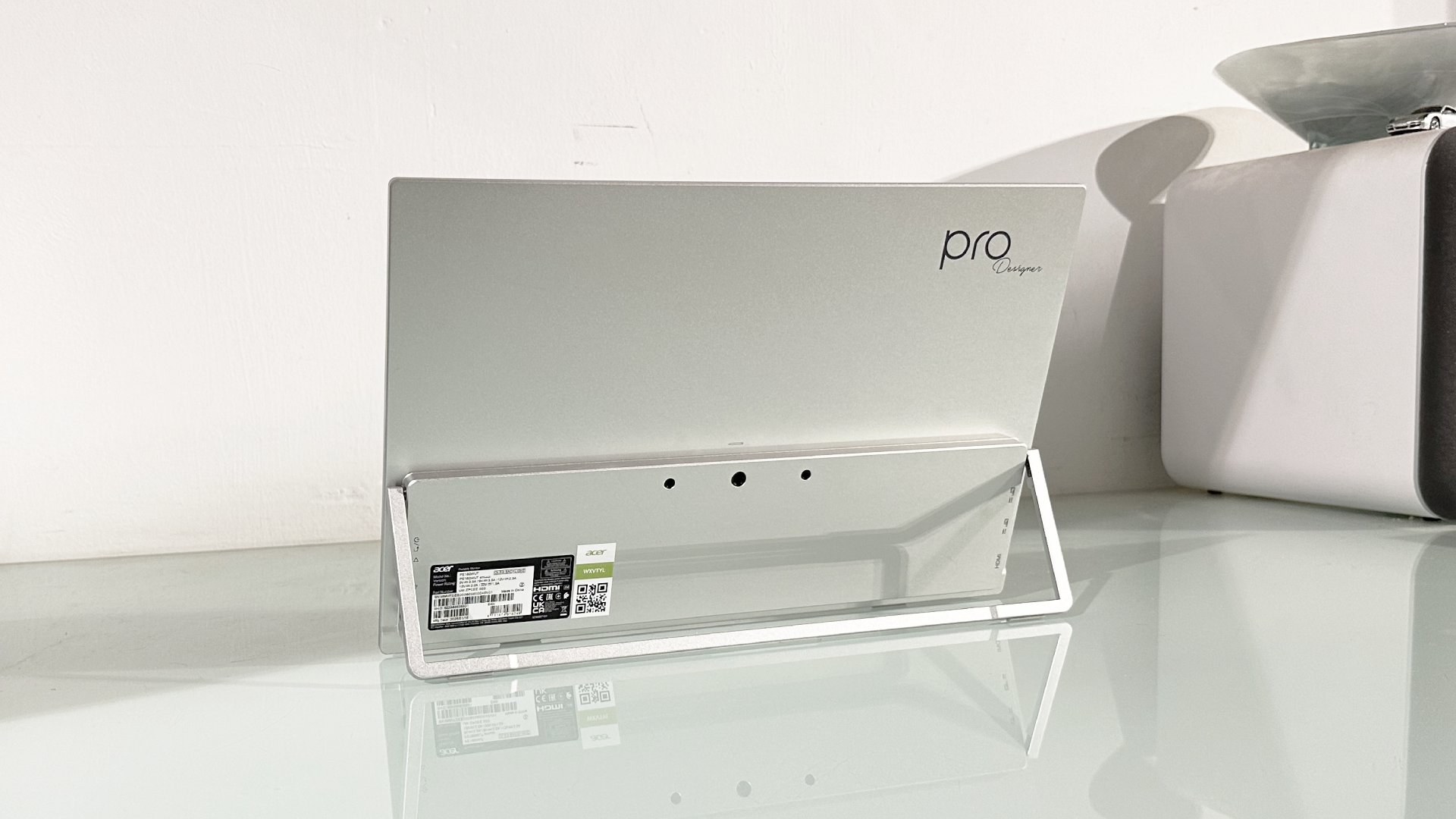 Testing the Acer ProDesigner PE160WUT in a home office next to a MacBook