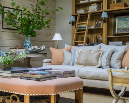 Rustic living room with sofa and large wooden ottoman and wooden open storage