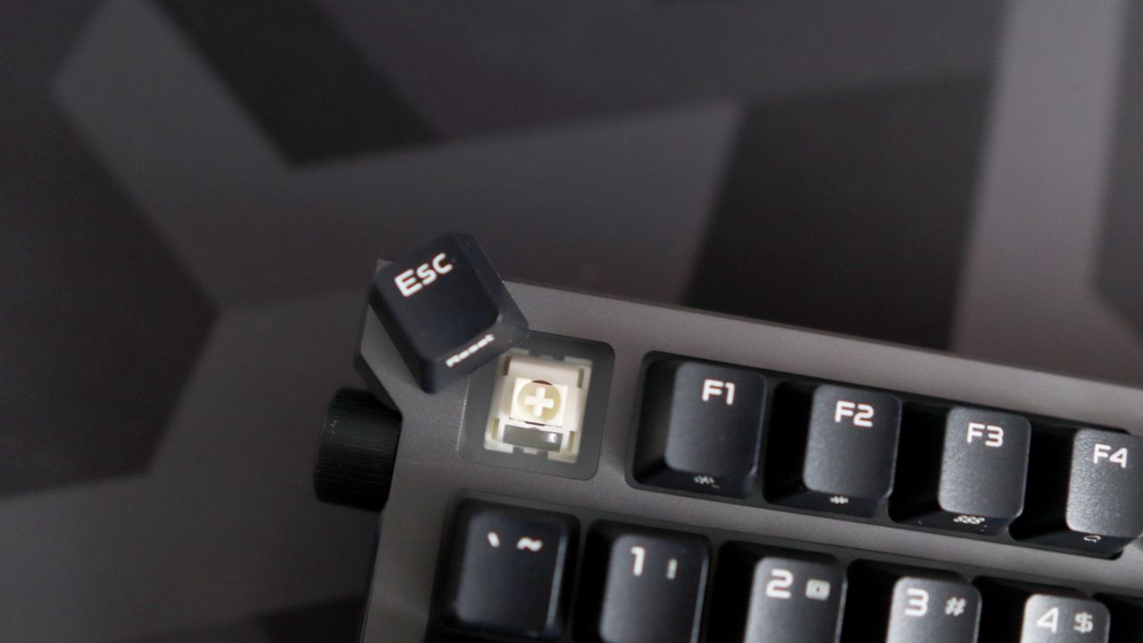 Asus ROG Strix Morph 96 Wireless on a desk mat.