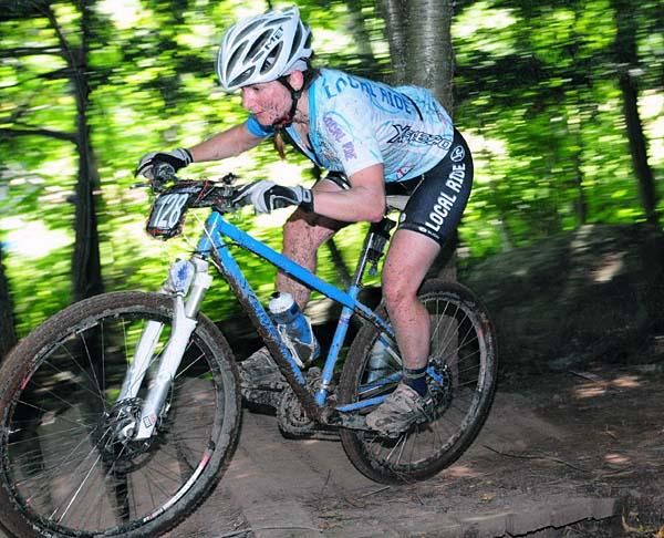 Sandra Walter (Local Ride) crosses a bridge.