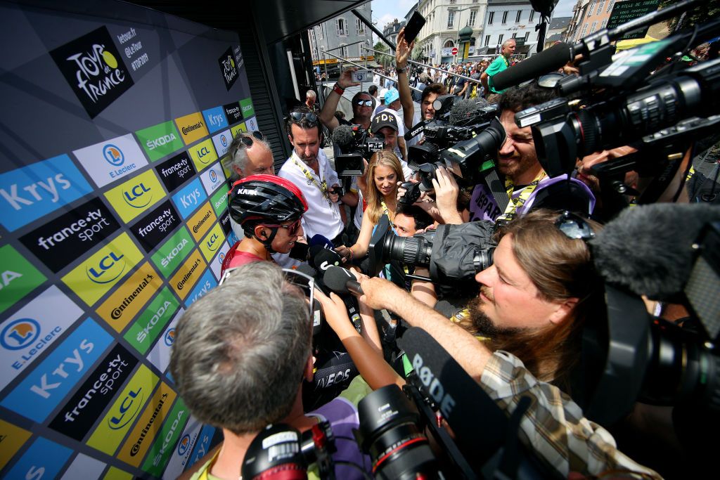 Egan Bernal (Team Ineos) mobbed by the press before stage 14
