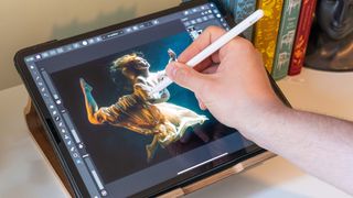 A person using an Apple Pencil 2 and iPad Pro to edit on Affinity Photo for iPad