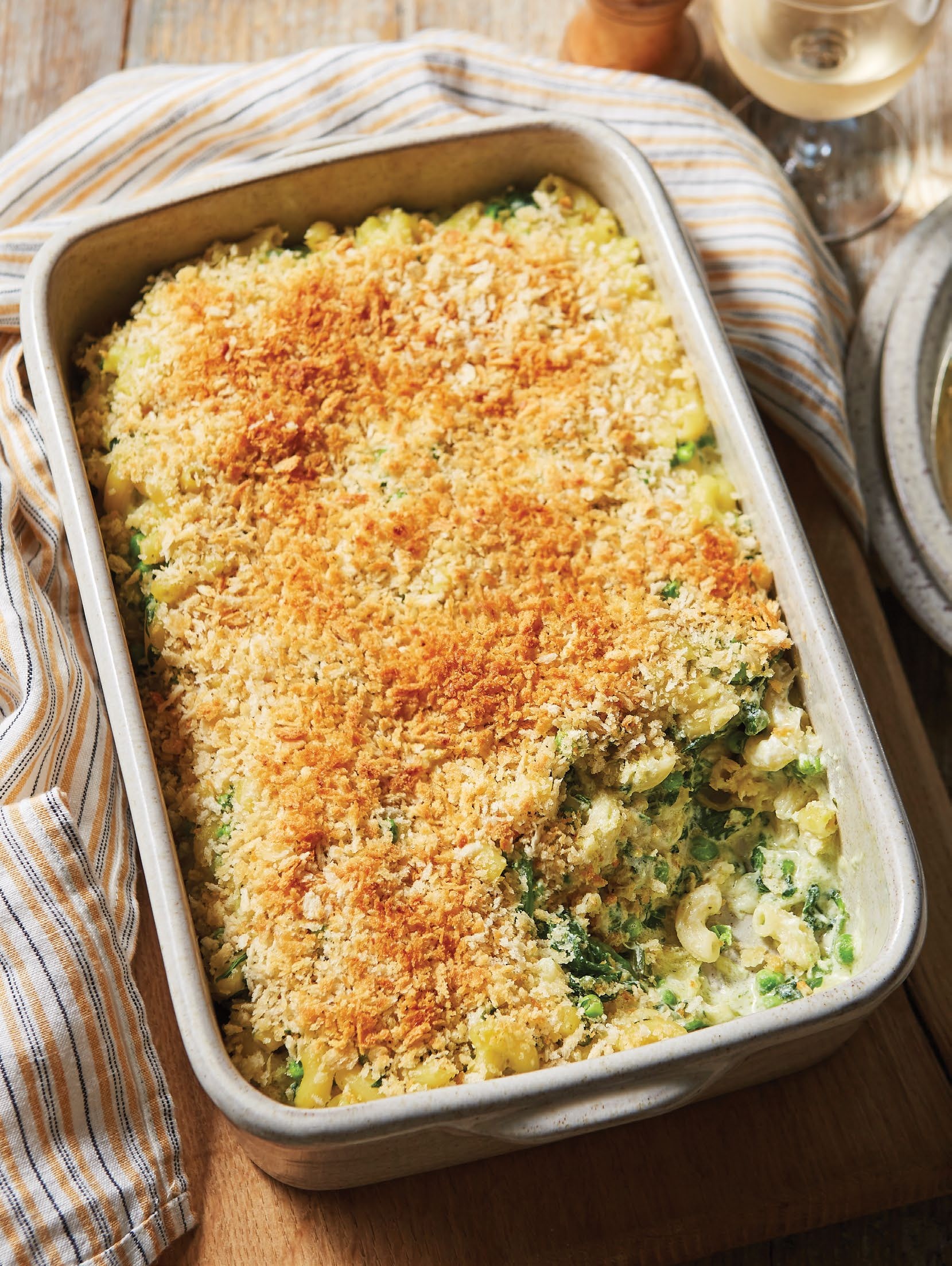 A photo of a Green mac and cheese in a serving dish