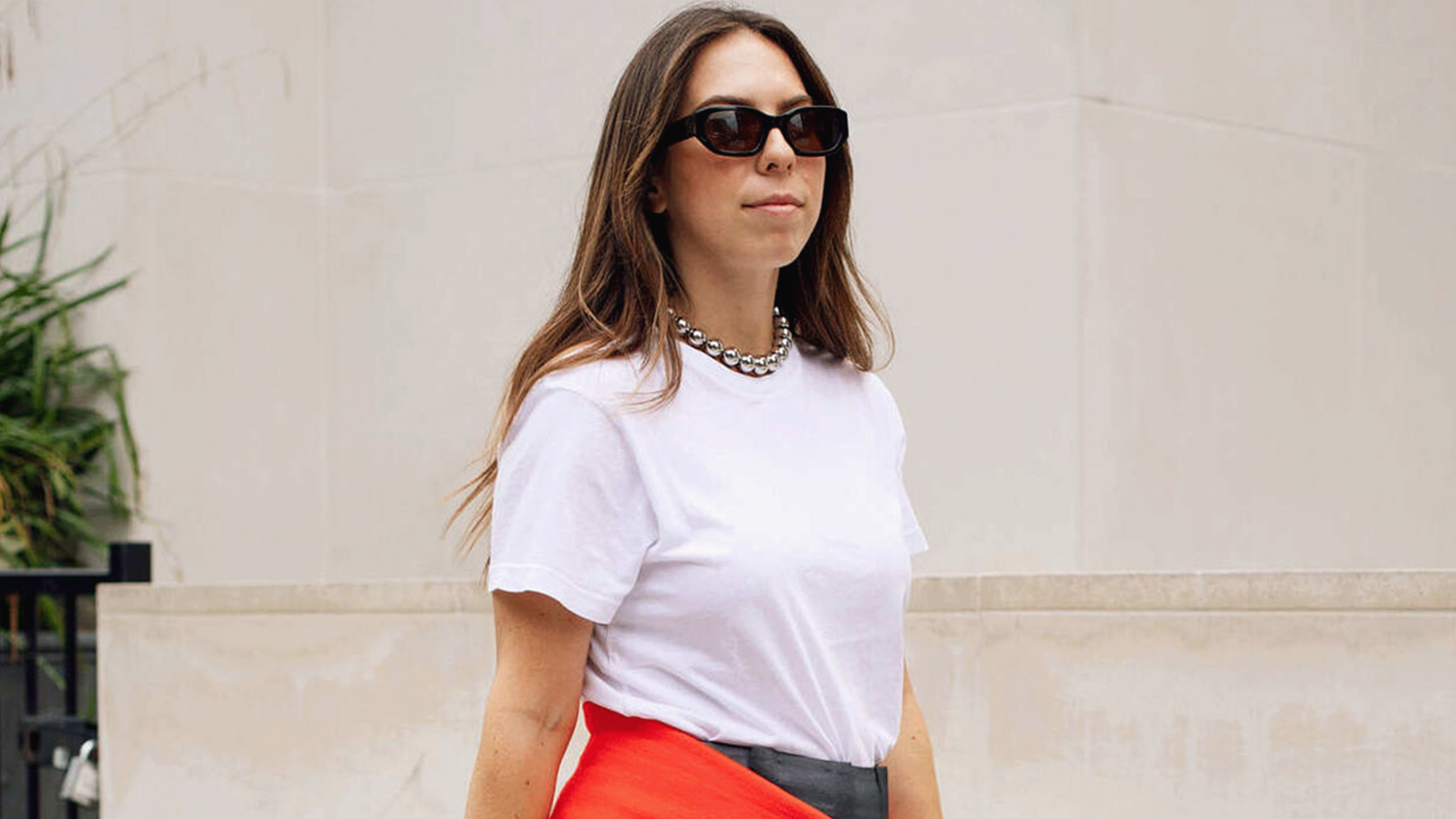 Lauren Eggertsen wearing a white tee and black leather skirt.