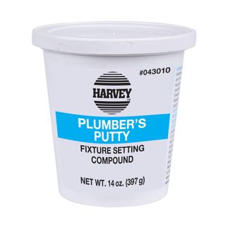 A white tub of plumber's putty with black text and a bright blue strip with white text