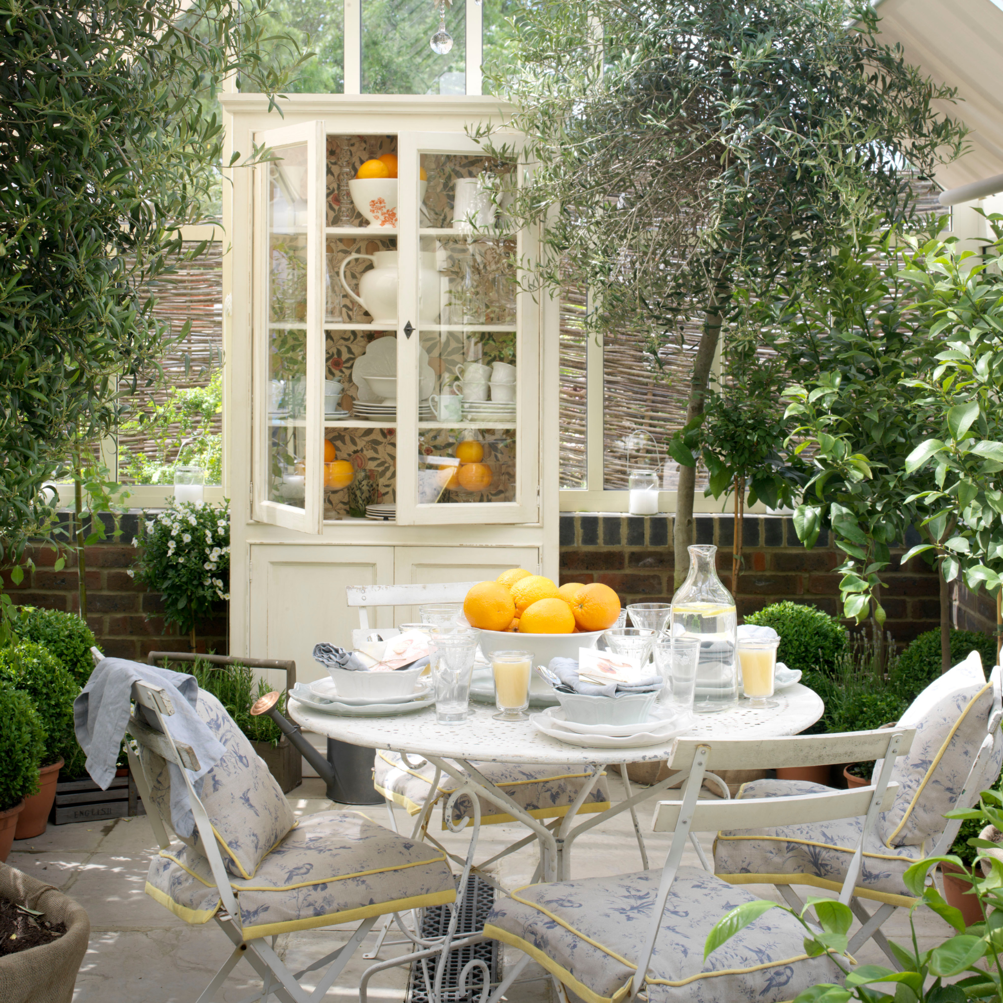 Greenhouse decorated for a dinner party.