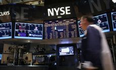 Traders work on the floor of the New York Stock Exchange during a record-setting day on March 5.