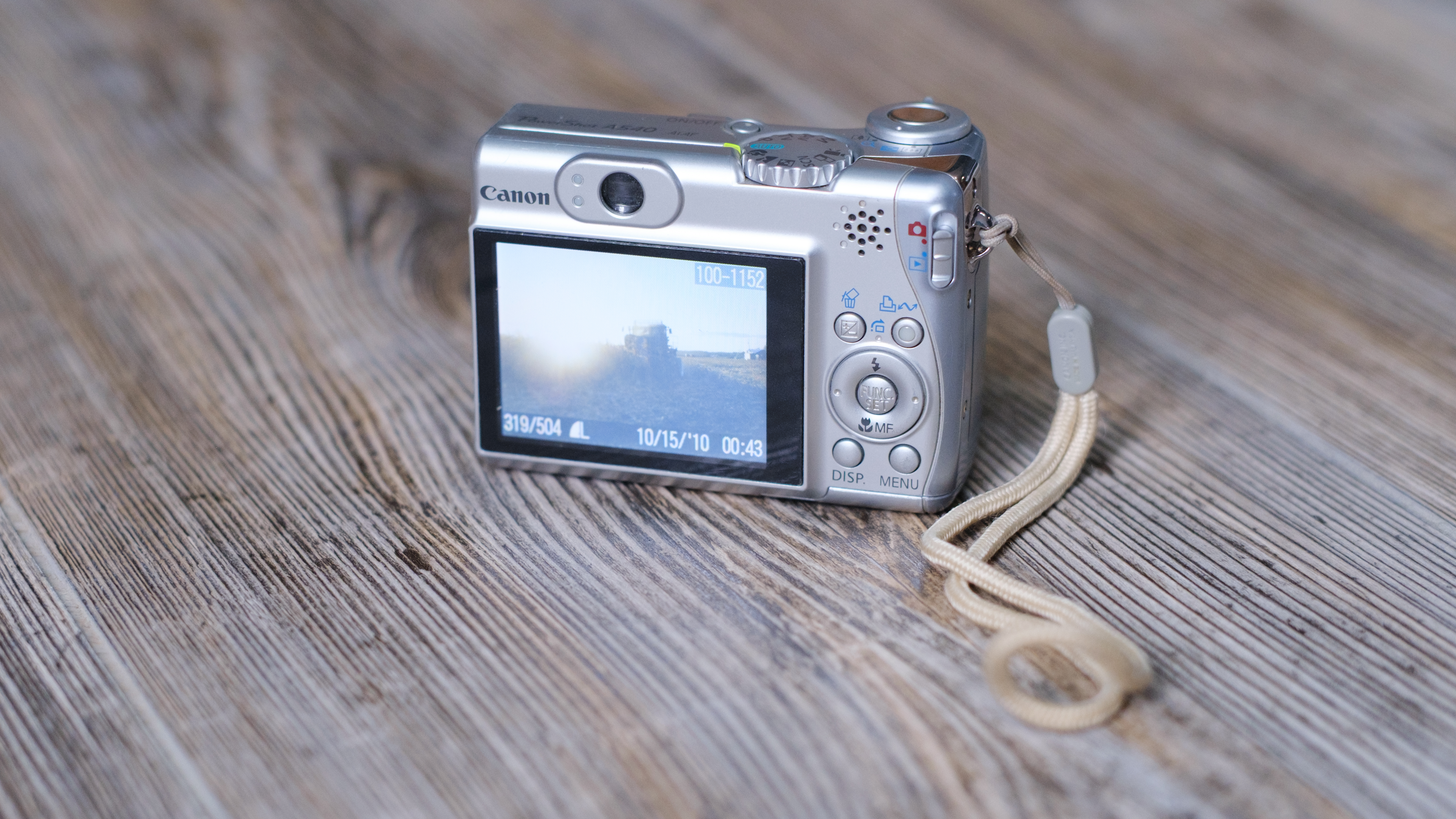 The Canon PowerShot A540 on a wood background