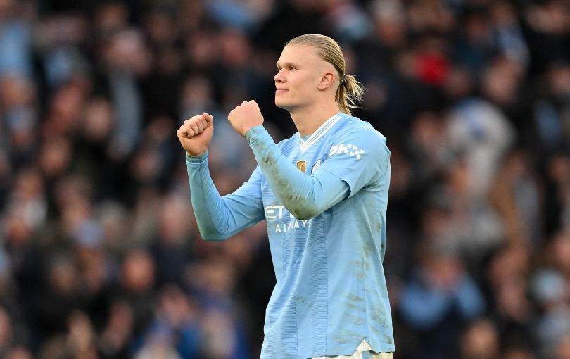 Erling Haaland celebrates beating Manchester United in the derby