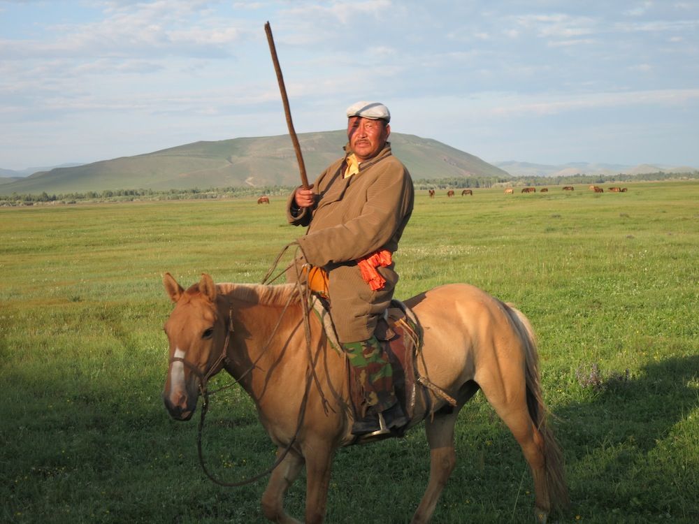 Mongolian man on a horse