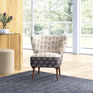 A chair with navy blue and cream patterned upholstery