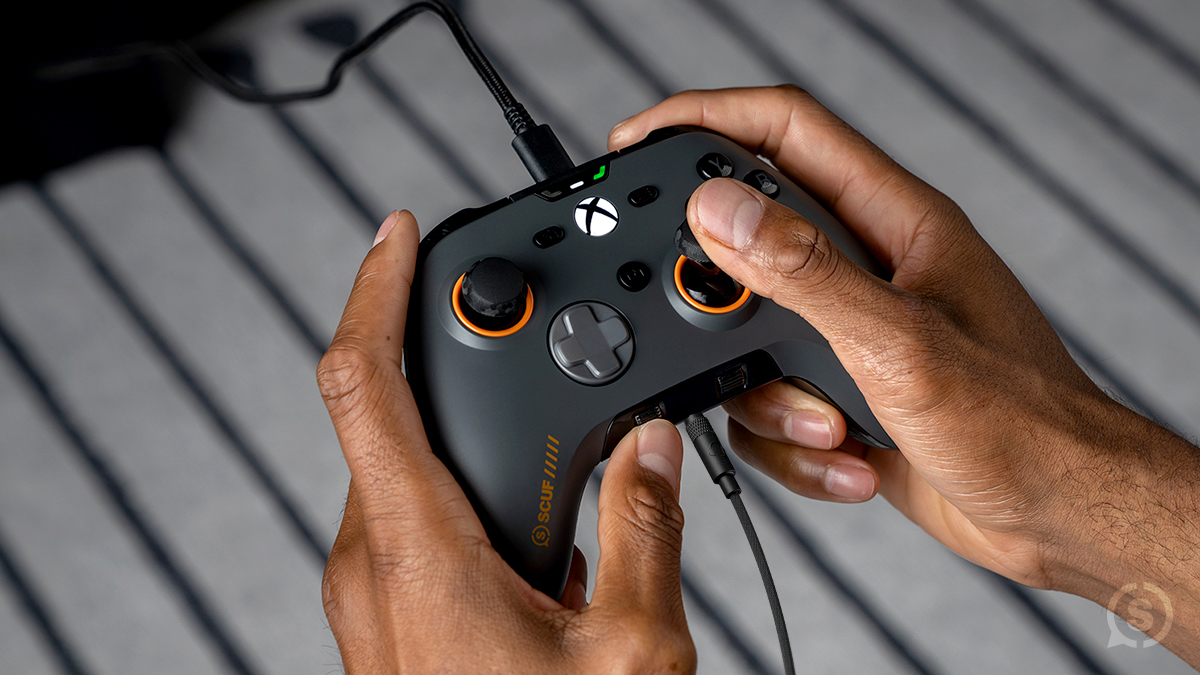 The latest SCUF Valor Pro Wired Performance Controller in gray with orange accents.