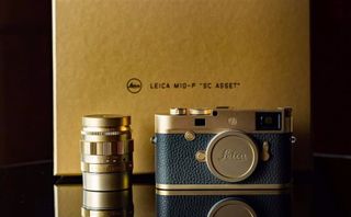 The Leica M10-P SC Asset and "kit lens" Leica Summilux-M 50mm f/1.4 ASPH lens, both in sandblasted brass