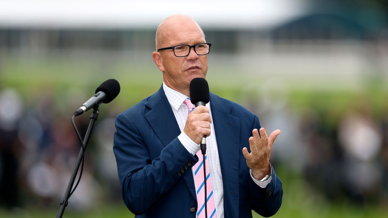 Guy Kinnings speaks into a microphone at the 2024 BMW PGA Championship