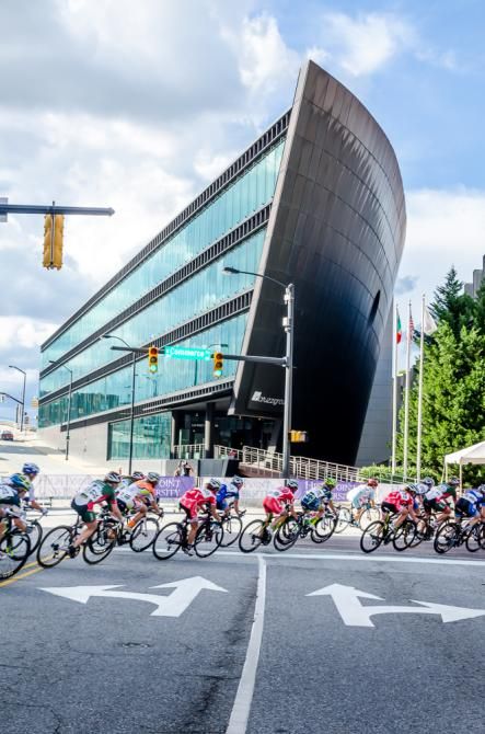 The women race past the Natuzzi Showroom building in downtown High Point, NC