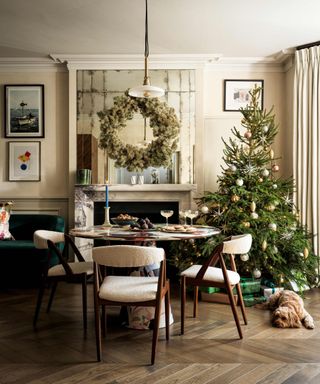 Dining room decorated for christmas with fireplace