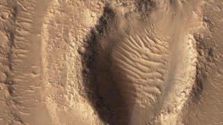 Hebrus Valles channels in the northern lowlands of Mars captured by the High Resolution Imaging Experiment (HiRISE) on board of NASA's Mars Reconnaissance Orbiter in late May 2022.