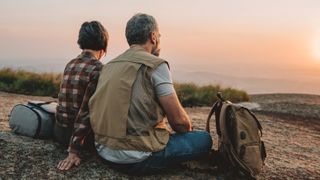 Senior couple watching sunset