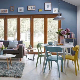 blue kitchen diner with dining table leon dining chairs sofa cushions and coffee table