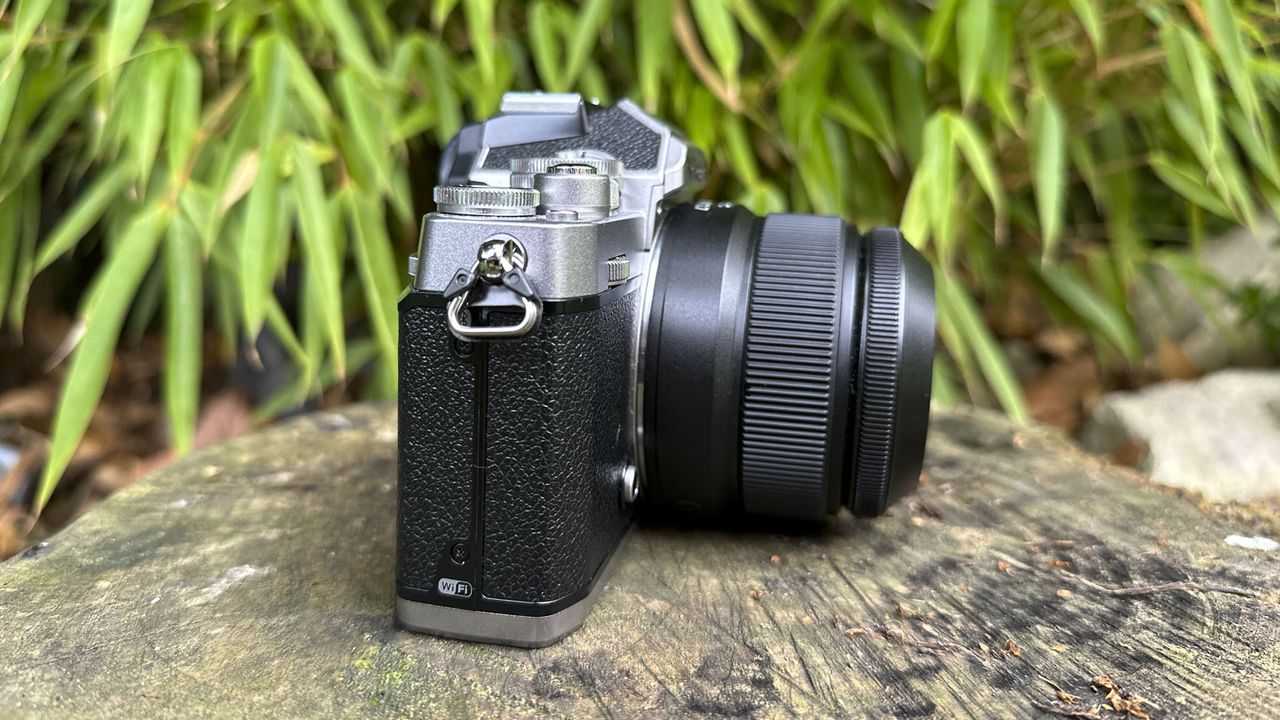 Nikkor Z DX 24mm f/1.7 lens side view with the lens mounted on a Nikon Z fc camera