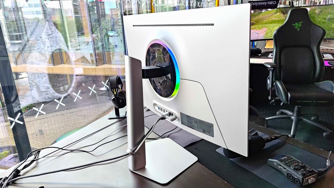 Back of Samsung Odyssey OLED G8 with RGB light and ports in view next to window