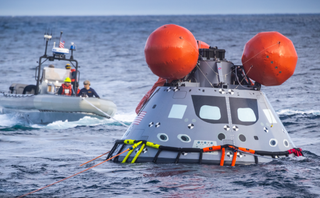 US Navy and NASA recovery teams practice for Orion's recovery.