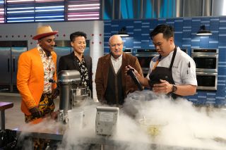 Buddha Lo uses liquid nitrogen to prepare his "Apavlova 14" moon-themed dessert as Top Chef: Houston judges Marcus Samuelsson, Melissa King and Tom Colicchio look on.