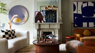 The eclectic living room of a Brooklyn Brownstone with mismatched furniture and textural details, from a fluffy pouf to black and white checkered cushions on the curved sofa alongside colorful decor