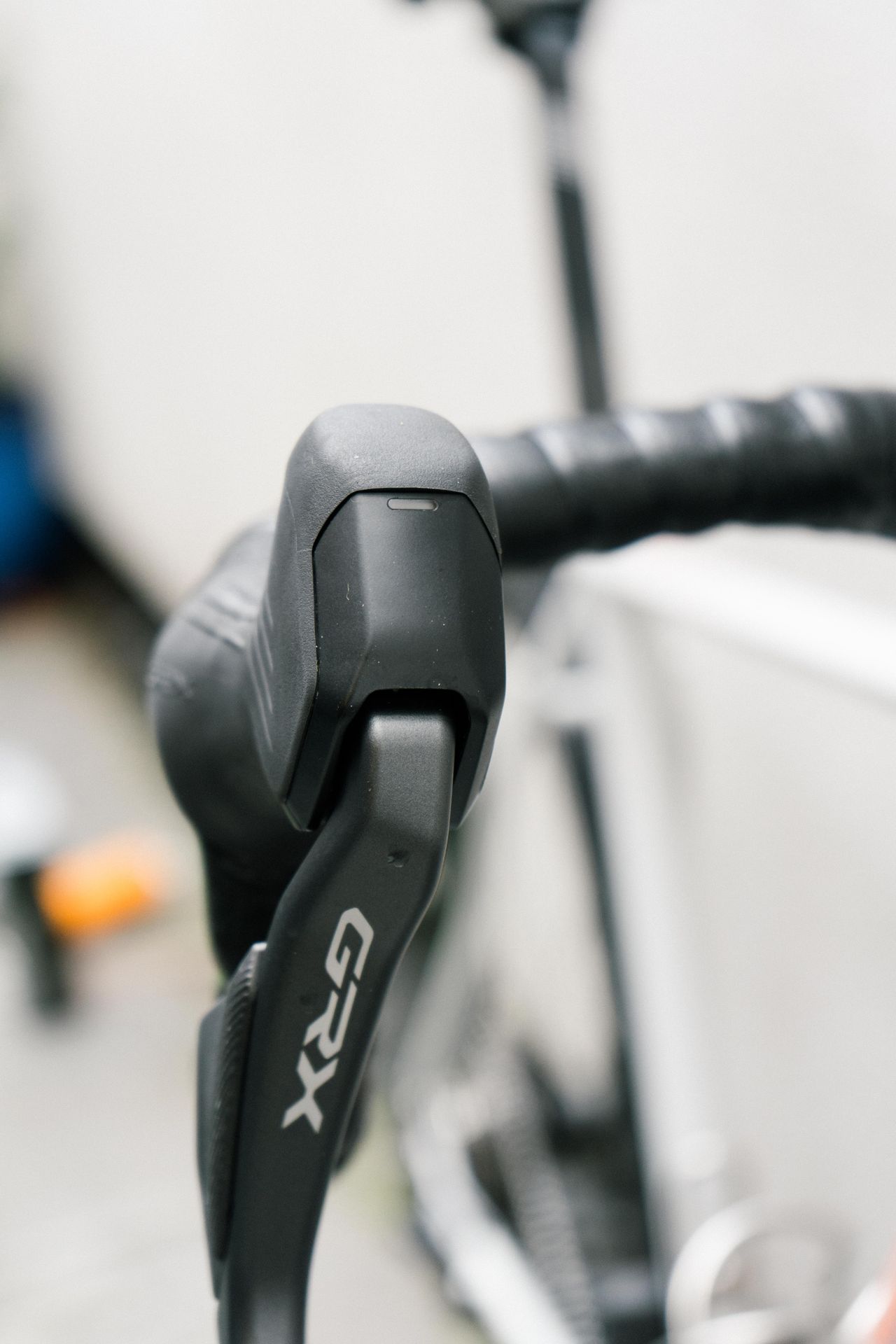 A close up of a grey shifter hood