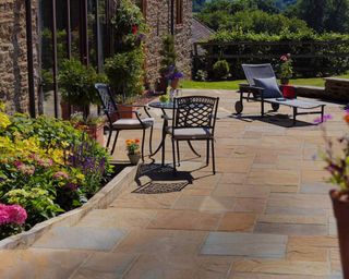 cloister flagstones from paving direct on patio with sleeper edging