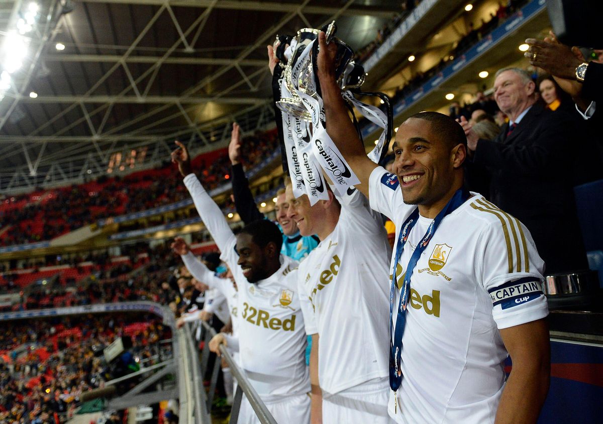 Swansea City lift the League Cup after beating Bradford City in the 2013 final at Wembley