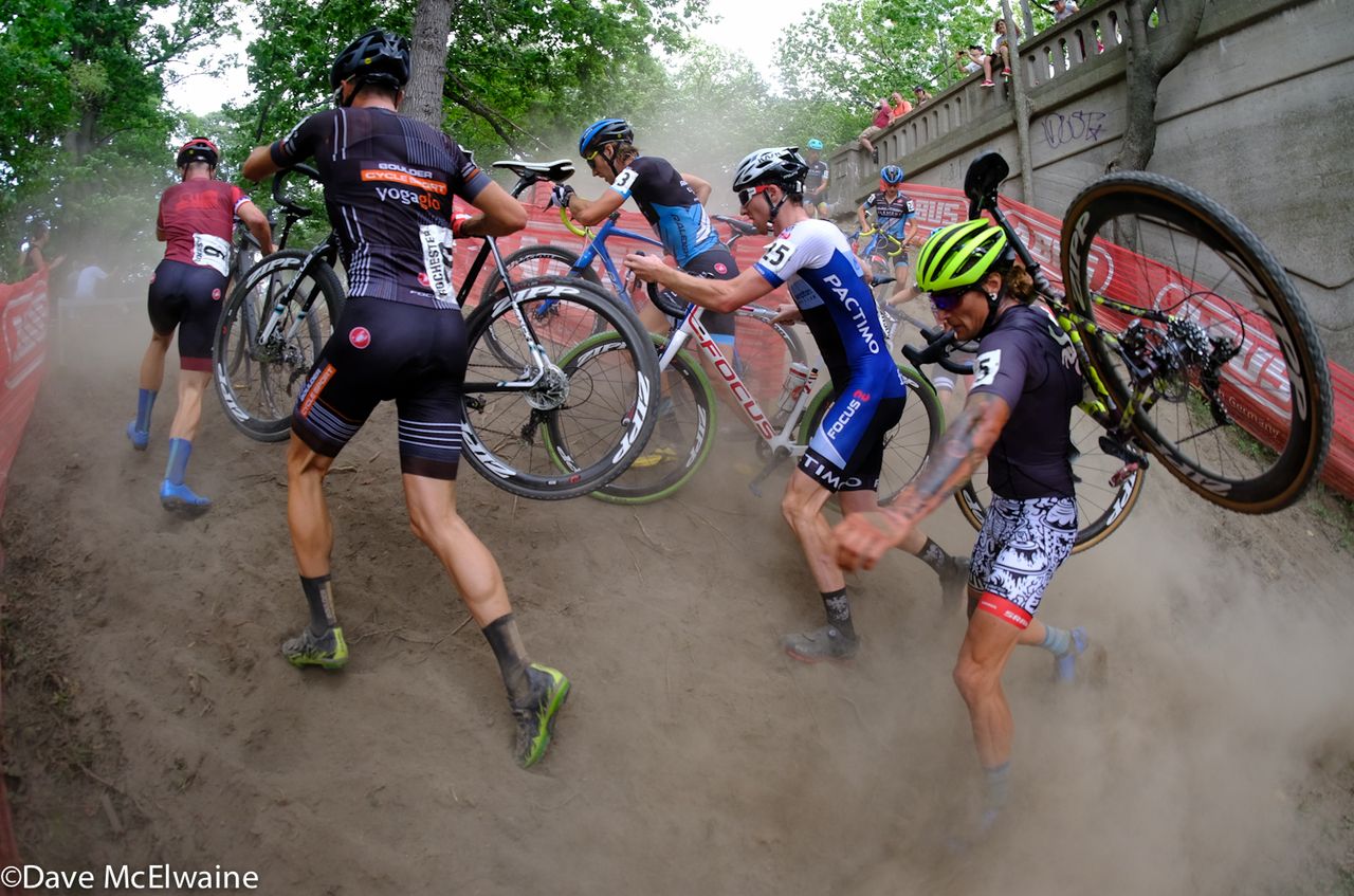 Anthony Clark (Squid Bikes) running in a cloud of dust.