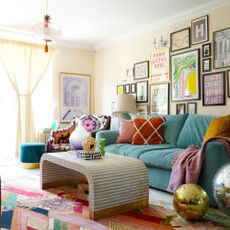 Colourful and eclectic living room with bright green sofa and multi-coloured rug