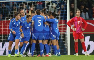  Sofia Cantore of Italy celebrates with teammates after scoring her teams second goal, Goalkeeper Ena Mahmutovic of Germany looks dejected during the Women's international friendly between Germany and Italy at Vonovia Ruhrstadion on December 2, 2024 in Bochum, Germany. 