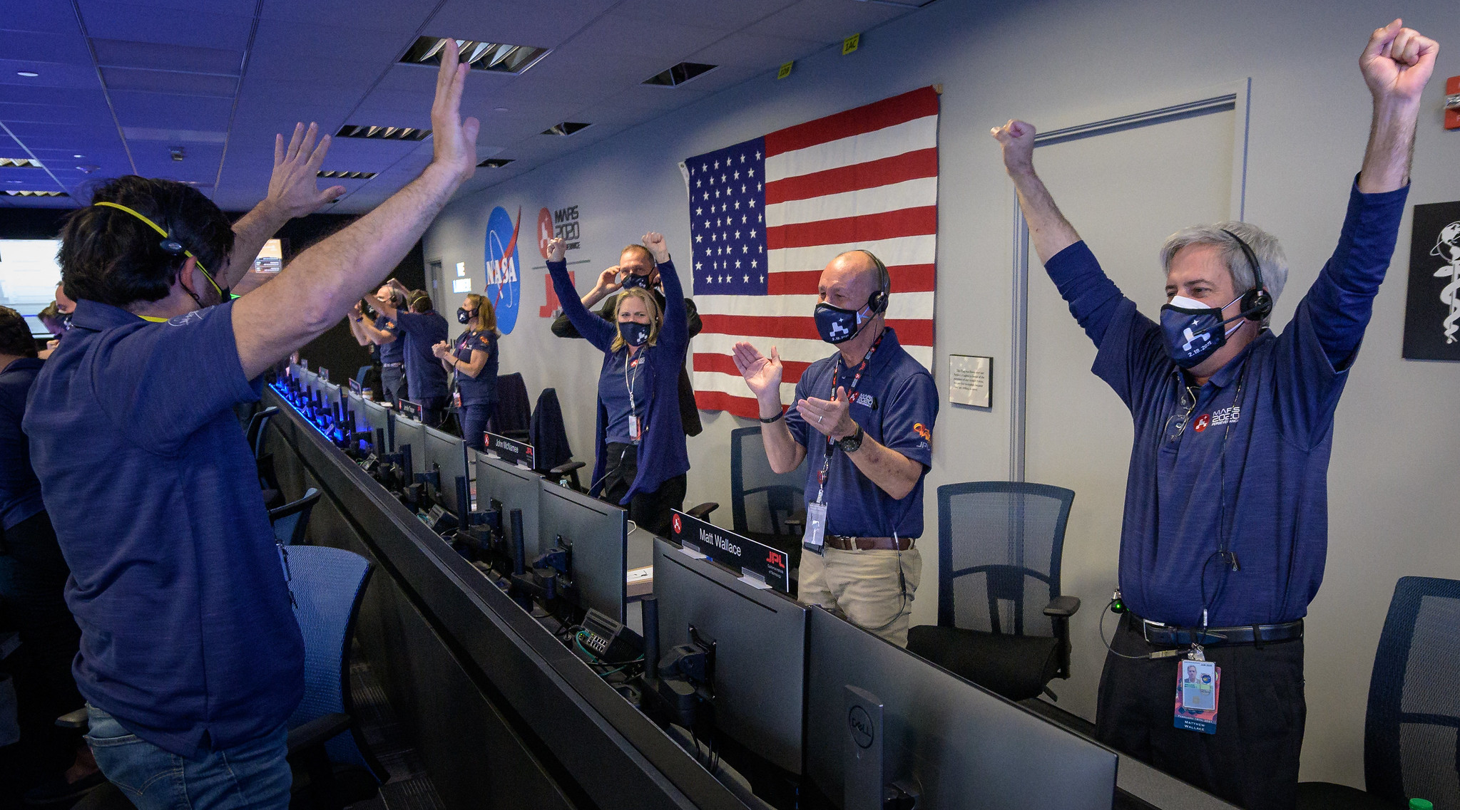 Members of NASA’s Perseverance rover team react in mission control after receiving confirmation the spacecraft successfully touched down on Mars, Thursday, Feb. 18, 2021, at NASA's Jet Propulsion Laboratory in Pasadena, California.