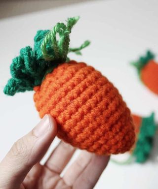 Crochet carrot egg cozy decoration for Easter.