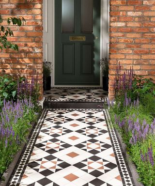 Victorian style paved pathway leading to a front door