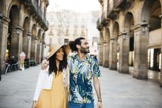 Young couple walking around Barcelona