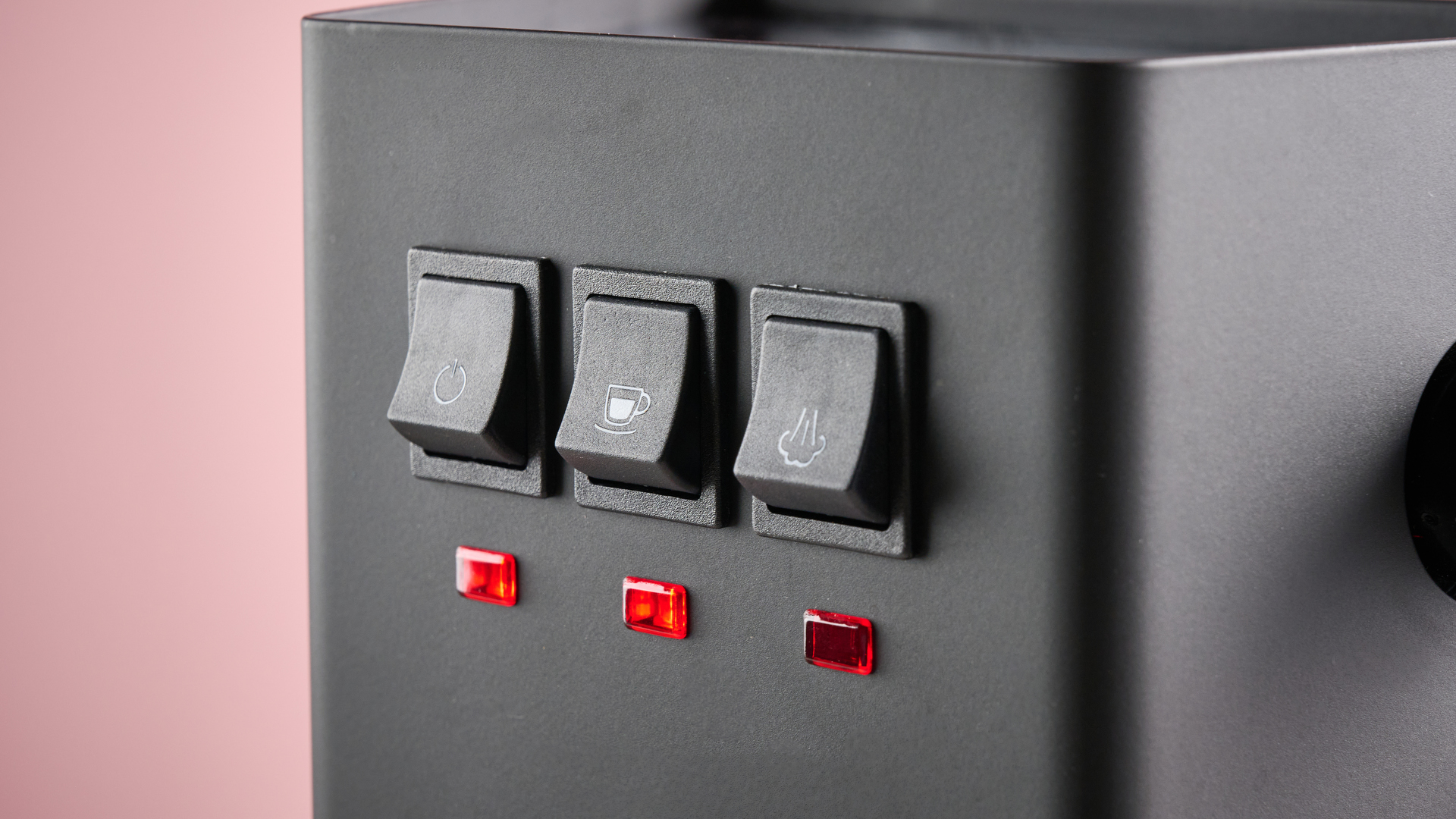 A closeup of the Gaggia Classic E24 Evo Pro&#039;s On, Espresso and Steam buttons.