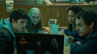 Roddy (Christopher Chung), Standish (Saskia Reeves), Louisa (Rosalind Eleazar), and Min (Dustin Demri-Burns) looking at a laptop in "Slow Horses" season 1.