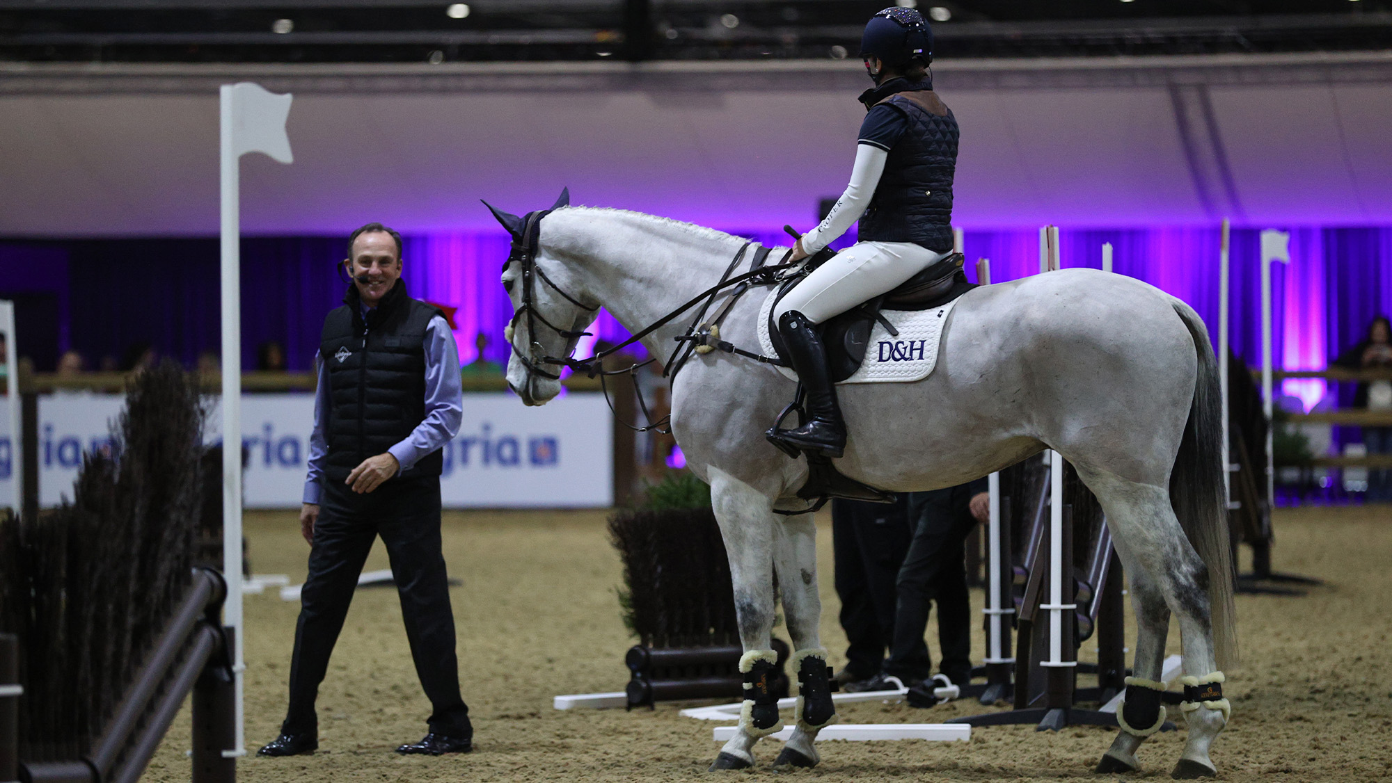 Richard Waygood training professional rider in Masterclass session at London International Horse Show