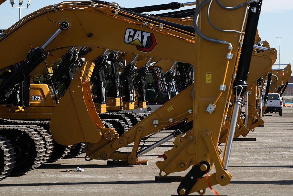 Caterpillar Inc. excavators sit on a cargo pier at the Port of Long Beach in California on January 14, 2026. 