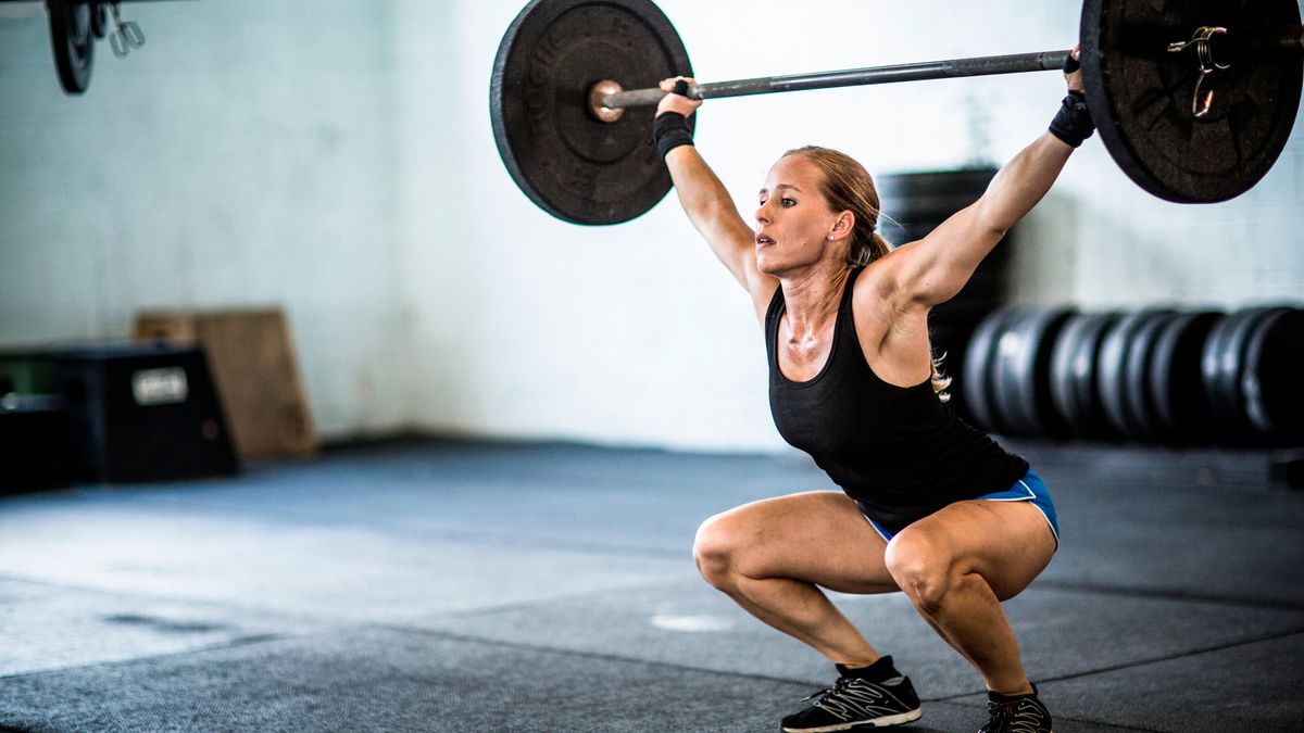 Woman performing overhead squat